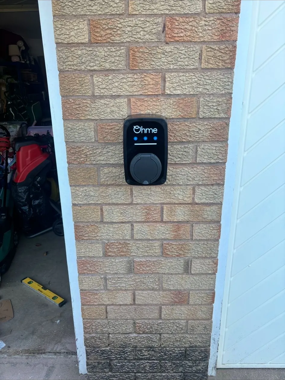 Untethered EV charge point on a brick pier