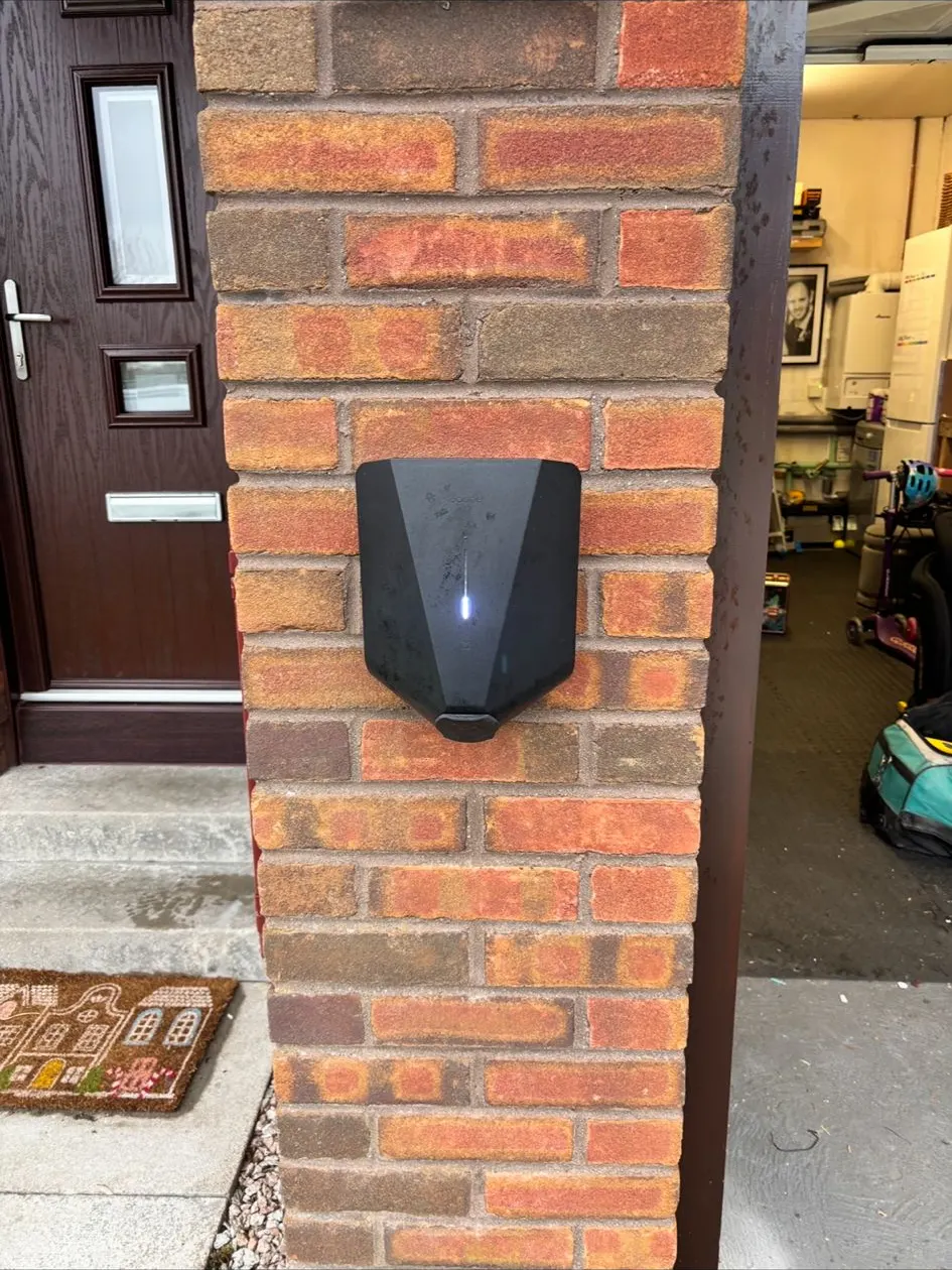 EV charger installed beside a composite front door