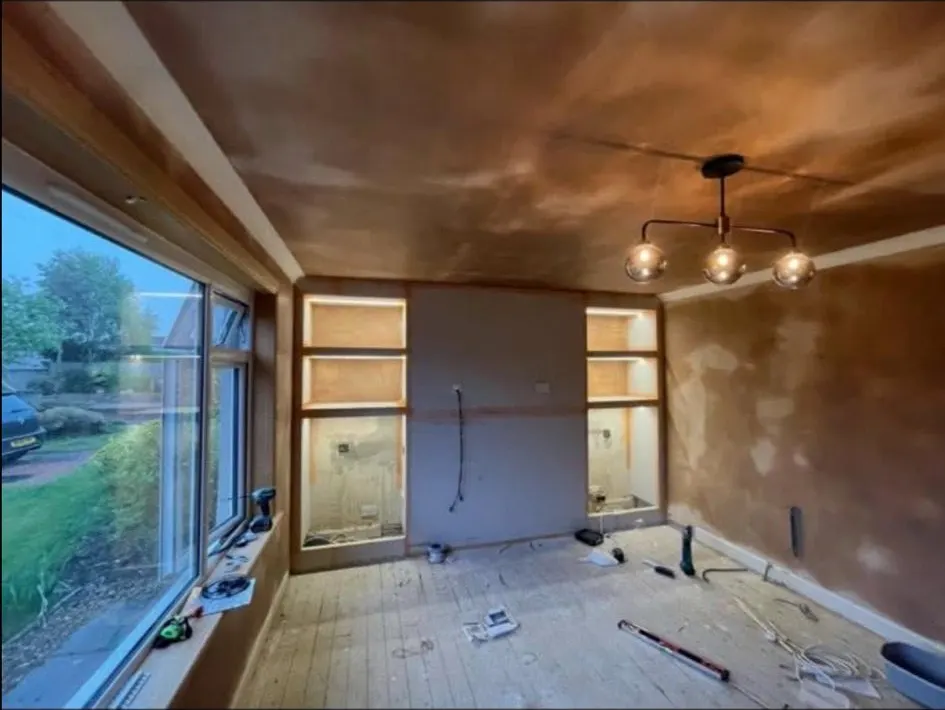Living room pendant and lit alcove shelving